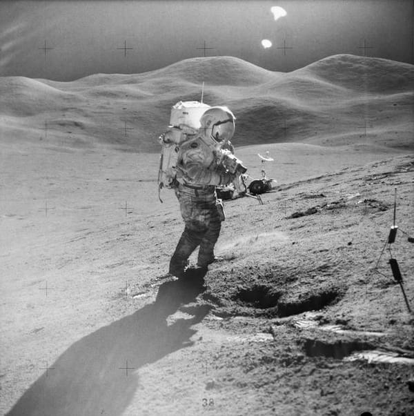 Astronaut David Scott on slope of Hadley Delta during Apollo 15 EVA